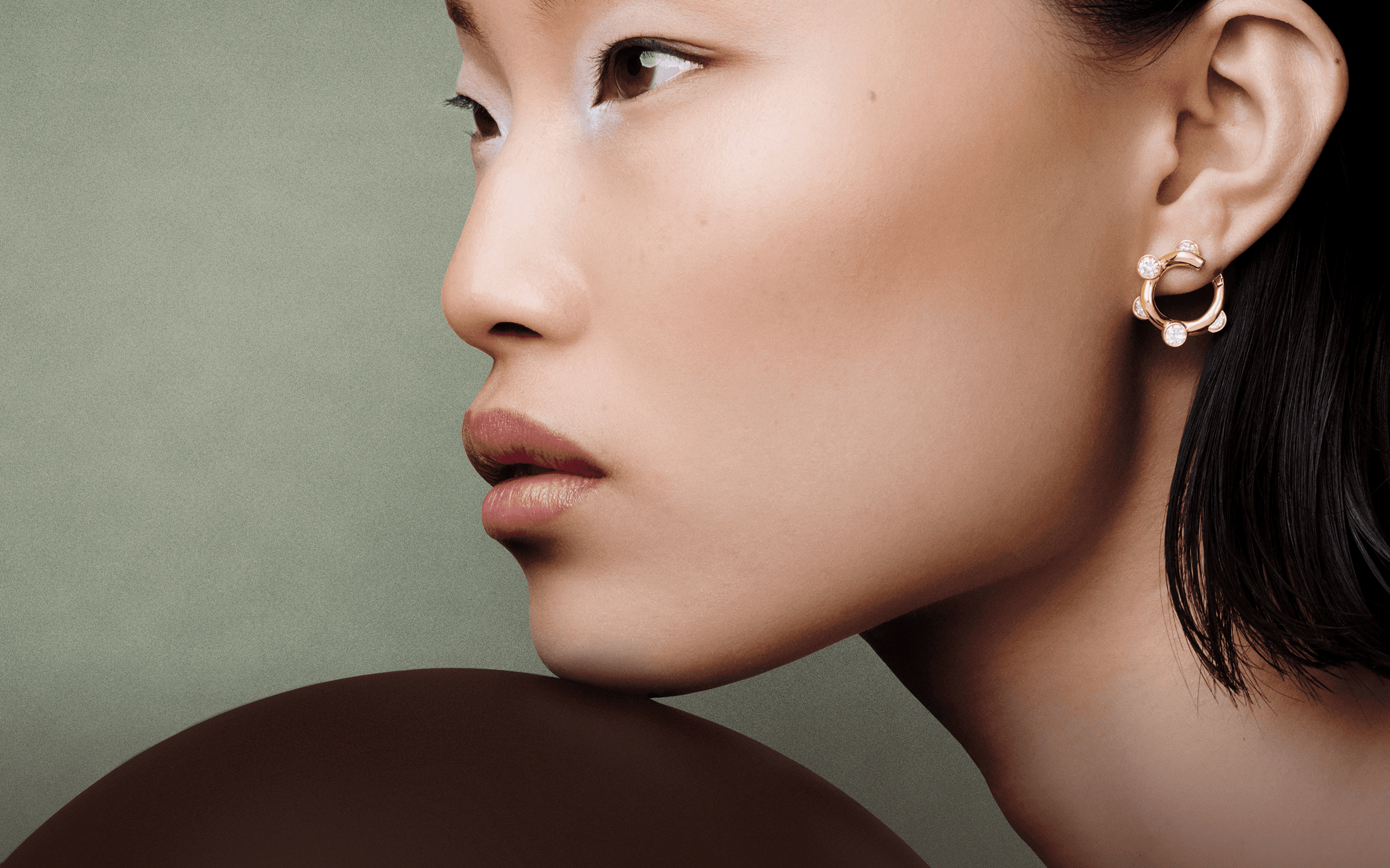 Model wearing Apparatta earrings