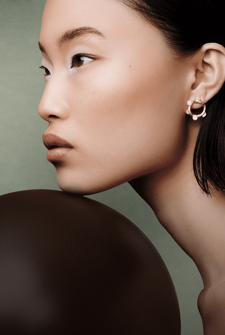Model wearing Apparatta earrings